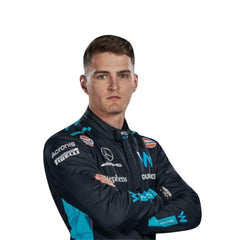 Close-up of 2023 Logan Sargeant F1 Racing Suit-Bestracewear showing textured blue fabric, white seams, and detailed black stitching around ventilation zones.
