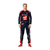 Nico Hülkenberg standing confidently in his 2023 Austin Grand Prix racing suit, featuring a deep navy blue base adorned with red accents and subtle star patterns