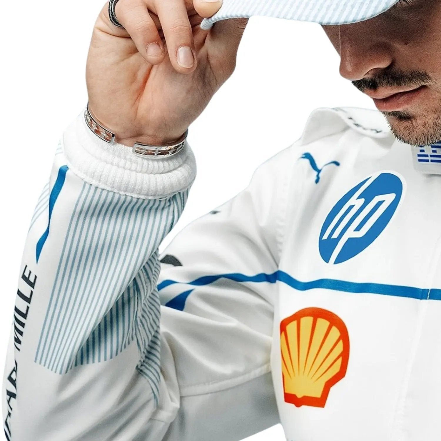 Detailed close-up of the 2025-Charles-Leclerc-Monaco-GP-F1-Racing-Suit showing Charles Leclerc's name, precision-stitched logos, and white and blue detail design_Bestracewear