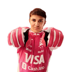 Bestracewear Isack Hadjar posing in his 2025 F1 race suit before the Miami Grand Prix, looking composed and race-ready.