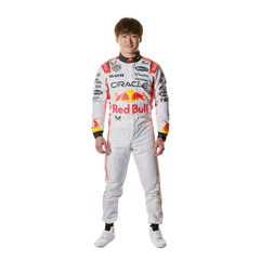 Side profile of Yuki Tsunoda's 2025 race suit, emphasizing the aerodynamic fit and the integration of blue and green elements on a white base_ Bestracewear