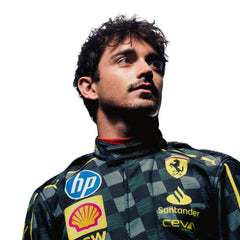 Close-up of 2024 Charles Leclerc Italy GP F1 racing suit from Bestracewear, displaying the intricate black material with Modena yellow stitching and sponsor logos.