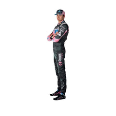 Right Side profile of Esteban Ocon's 2023 Las Vegas Grand Prix racing suit highlighting the pink and blue side panels against the black base, with sponsor details on the arms and legs, emphasizing the suit's tailored fit.