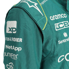 Close-up of the fabric and stitching on Fernando Alonso’s 2023 F1 racing suit, capturing the high-quality material and detailed sponsor branding, designed for durability and race-ready functionality.