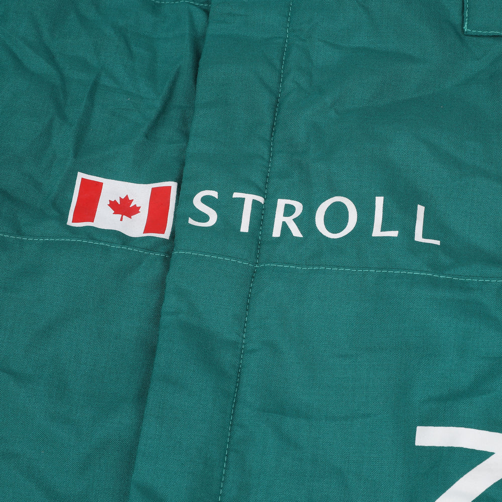 Close-up shot of Lance Stroll’s 2023 F1 racing suit fabric and stitching, focusing on the high-quality material and visible sponsor branding, emphasizing durability and race-ready functionality.Bestracewear