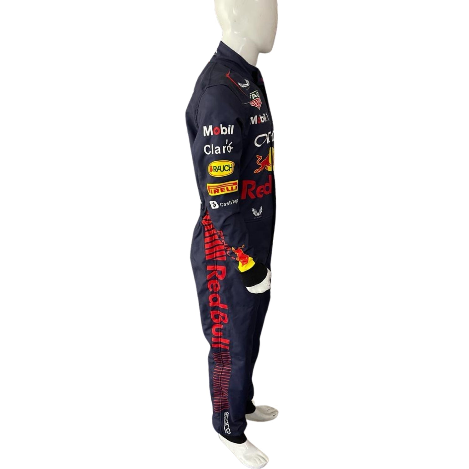 Side angle showing Verstappen’s navy blue race suit with dynamic red accents along the torso and yellow detailing around the sleeves.Bestracewear