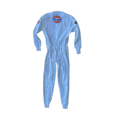 Rear shot of the 1971 Le Mans racing suit from Steve McQueen’s role as Michael Delaney, highlighting clean tailoring, minimalistic back panel, and retro silhouette.Bestracewear