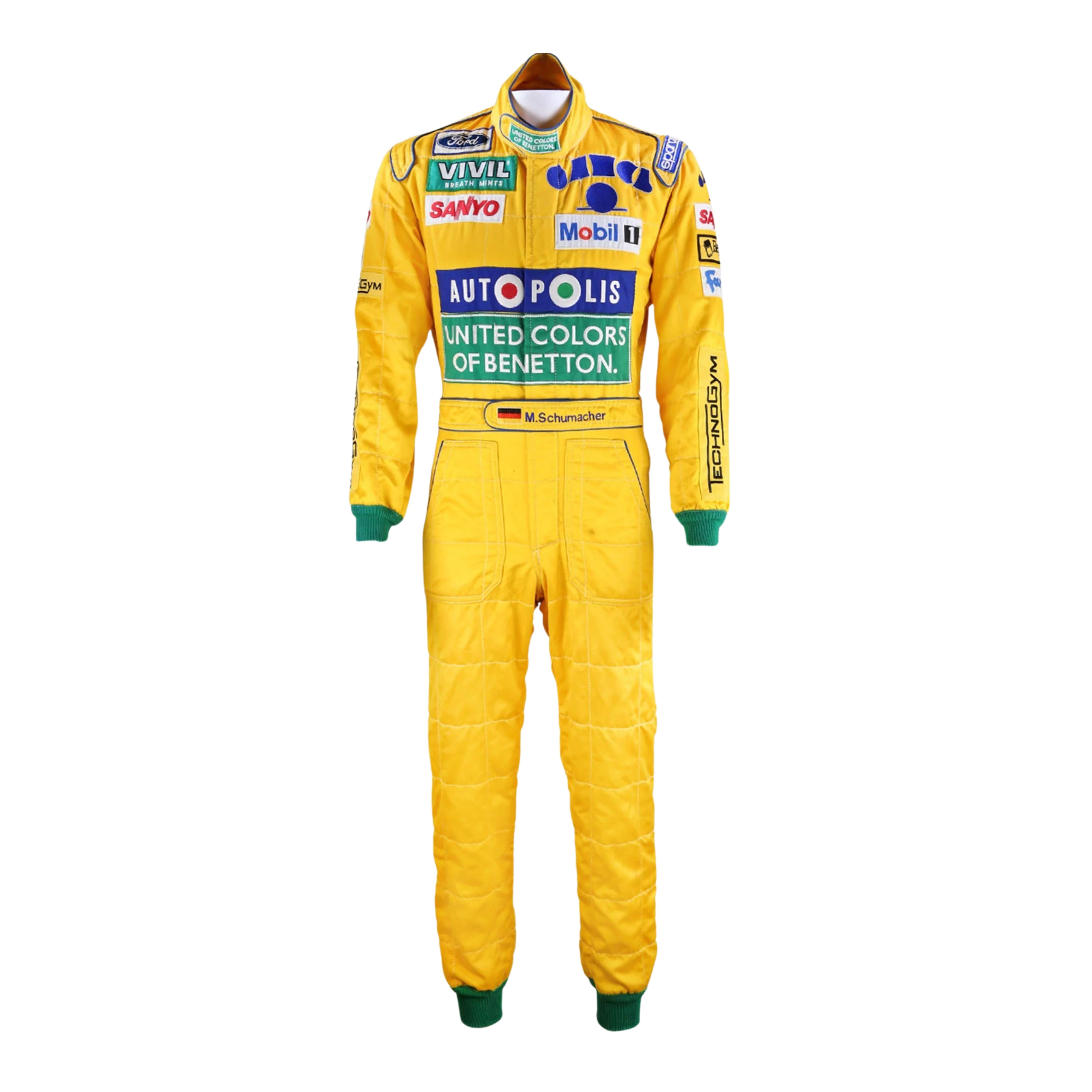 Front view of Michael Schumacher's 1992 F1 racing suit featuring deep green with yellow accents, signature Benetton sponsorship, and classic zip-front design.Bestracewear