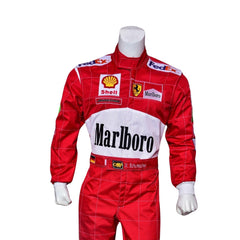 Close-up of Schumacher’s 2000 F1 suit, showing the high-quality stitching, red fabric, and precise logo placement that marked his championship victory. Bestracewear
