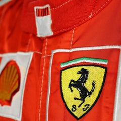 Close-up shot of Schumacher’s 2006 race suit, highlighting the detailed stitching, premium red material, and signature white branding elements.Bestracewear