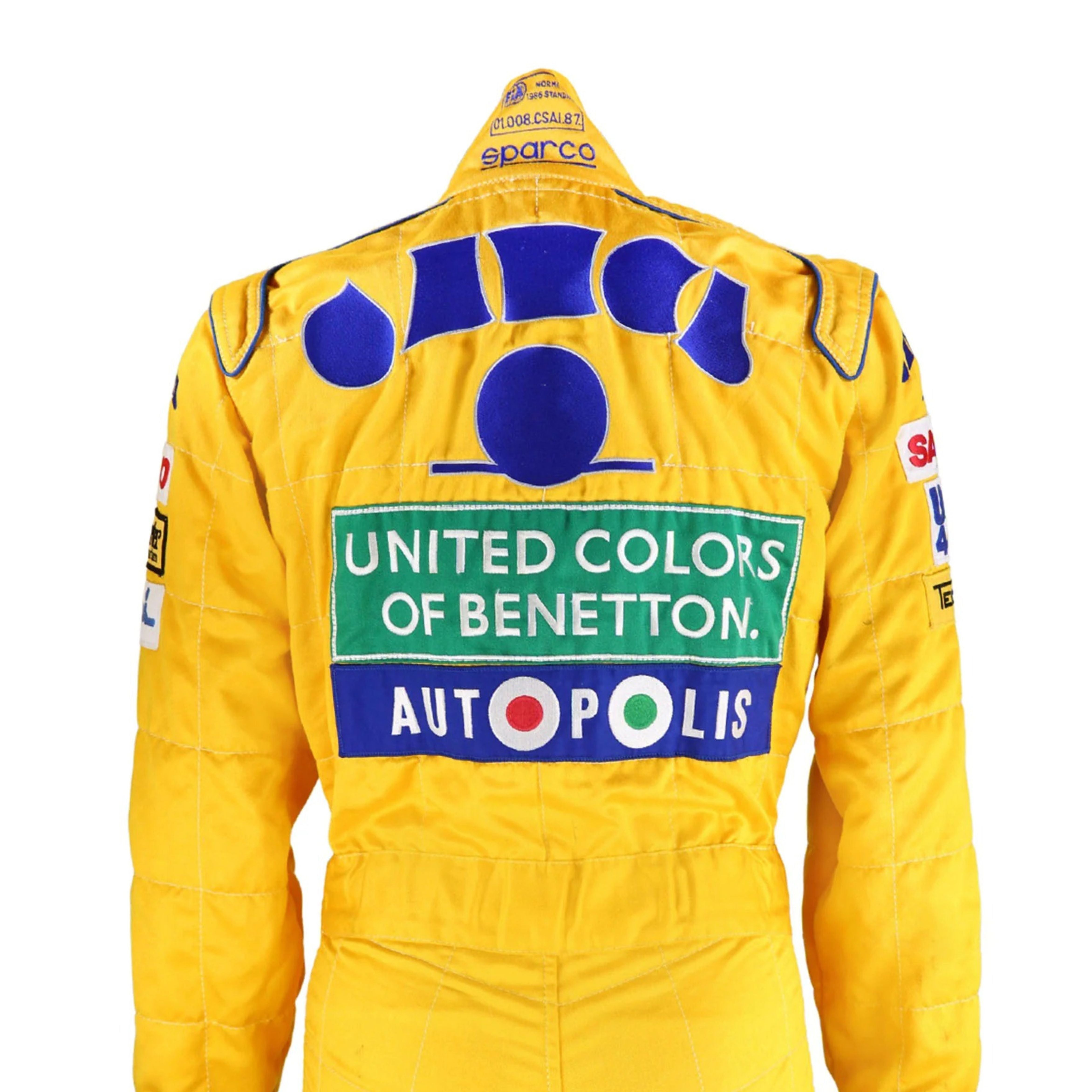 Back side of the 1992 Formula 1 suit worn by Michael Schumacher, showcasing era-specific sponsor logos and reinforced fabric seams for  safety.Bestracewear