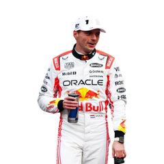 Max Verstappen in action during the 2025 Japanese Grand Prix at Suzuka, wearing his special edition white race suit with red accents. bestracewear