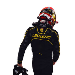 Rear view of 2024 Charles Leclerc Italy GP F1 racing suit from Bestracewear , featuring a black base with Modena yellow detailing along with prominent sponsor logos.