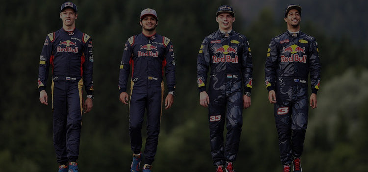 Four individuals wearing Red Bull f1 racing suits-Bestracewear standing side by side against a dark background.