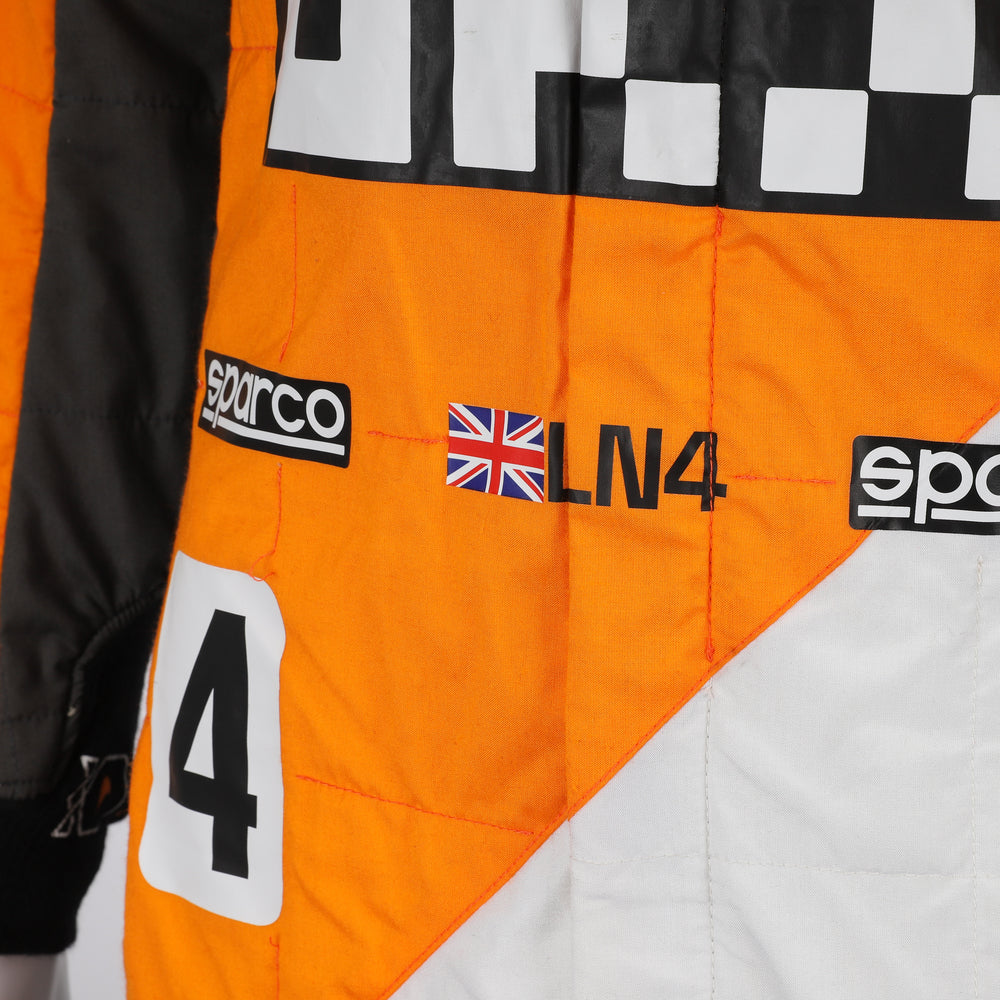 Close-up of the special edition Spanish GP racing suit showcasing premium fabric texture and subtle commemorative graphics.Bestracewear