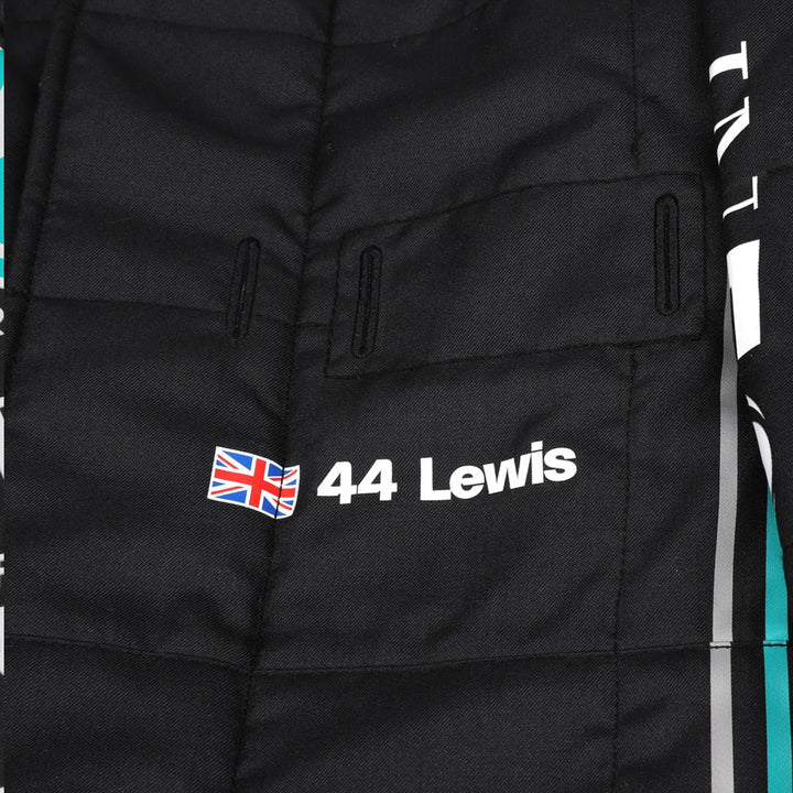 Close-up of Hamilton’s 2023 F1 suit detailing the fabric texture and fine stitching, with clear sponsor placements. Bestracewear