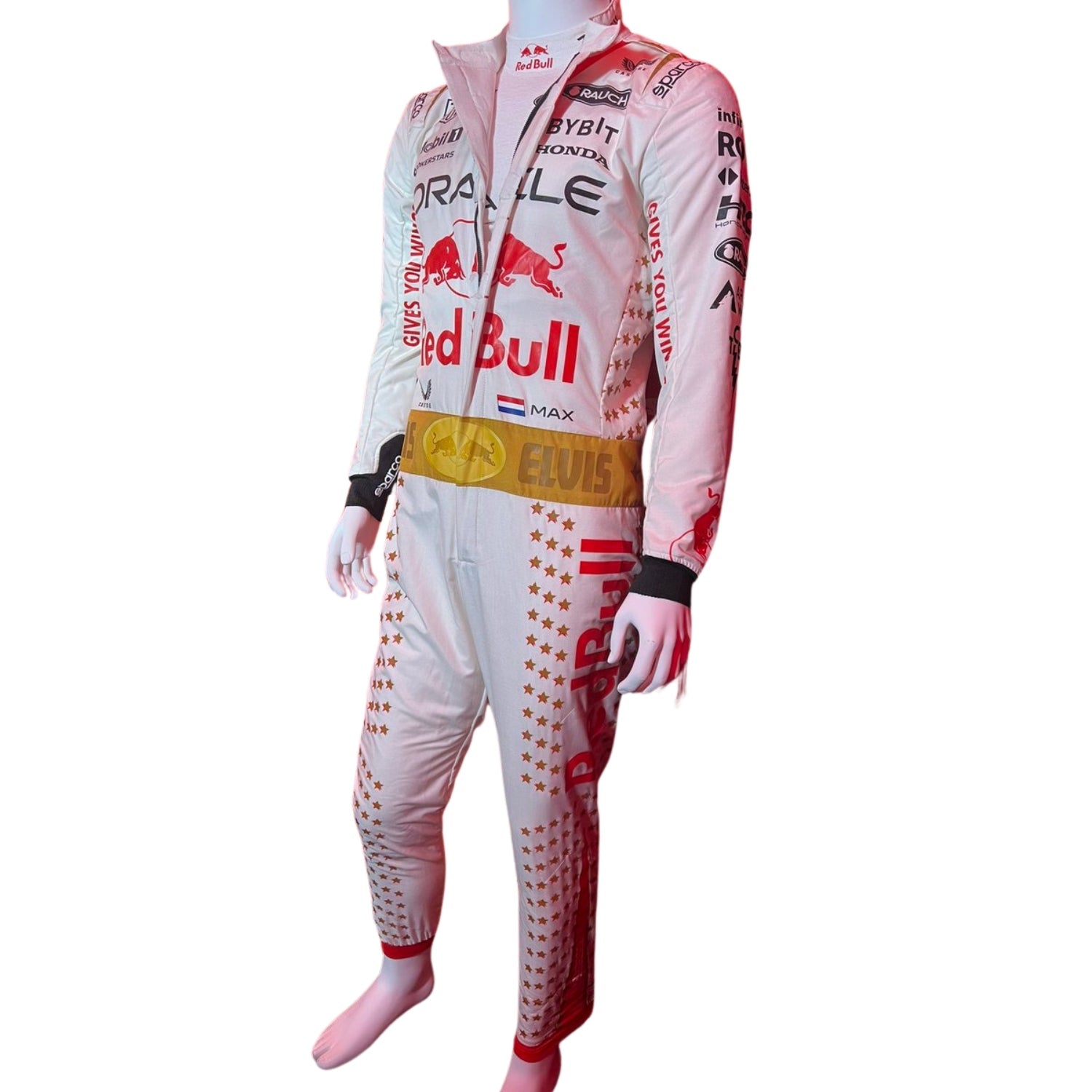 Max Verstappen in the 2023 Las Vegas GP racing suit featuring a crisp white base with gold star embellishments, red accents, and a signature Elvis-style belt. Bestracewear