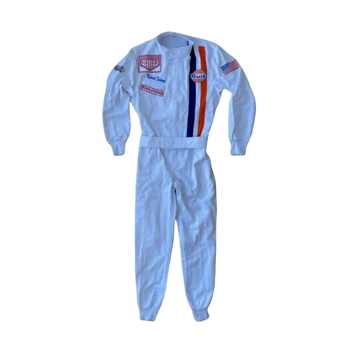 Front view of Michael Delaney’s 1971 Le Mans racing suit worn by Steve McQueen, featuring off-white base, vertical Gulf racing stripes in blue and orange, and vintage patchwork detailing _ Bestracewear