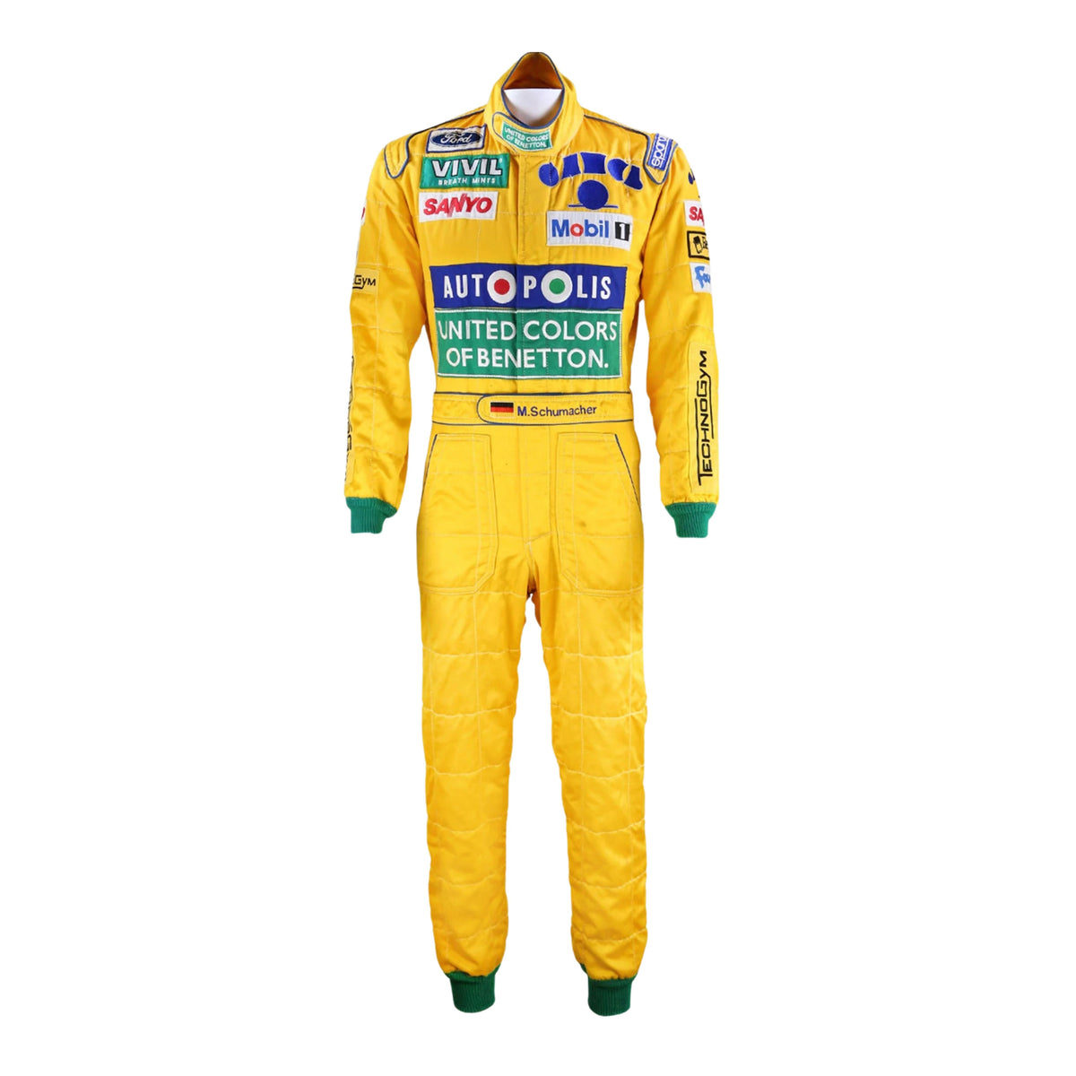 Front view of Michael Schumacher's 1992 F1 racing suit featuring deep green with yellow accents, signature Benetton sponsorship, and classic zip-front design.Bestracewear