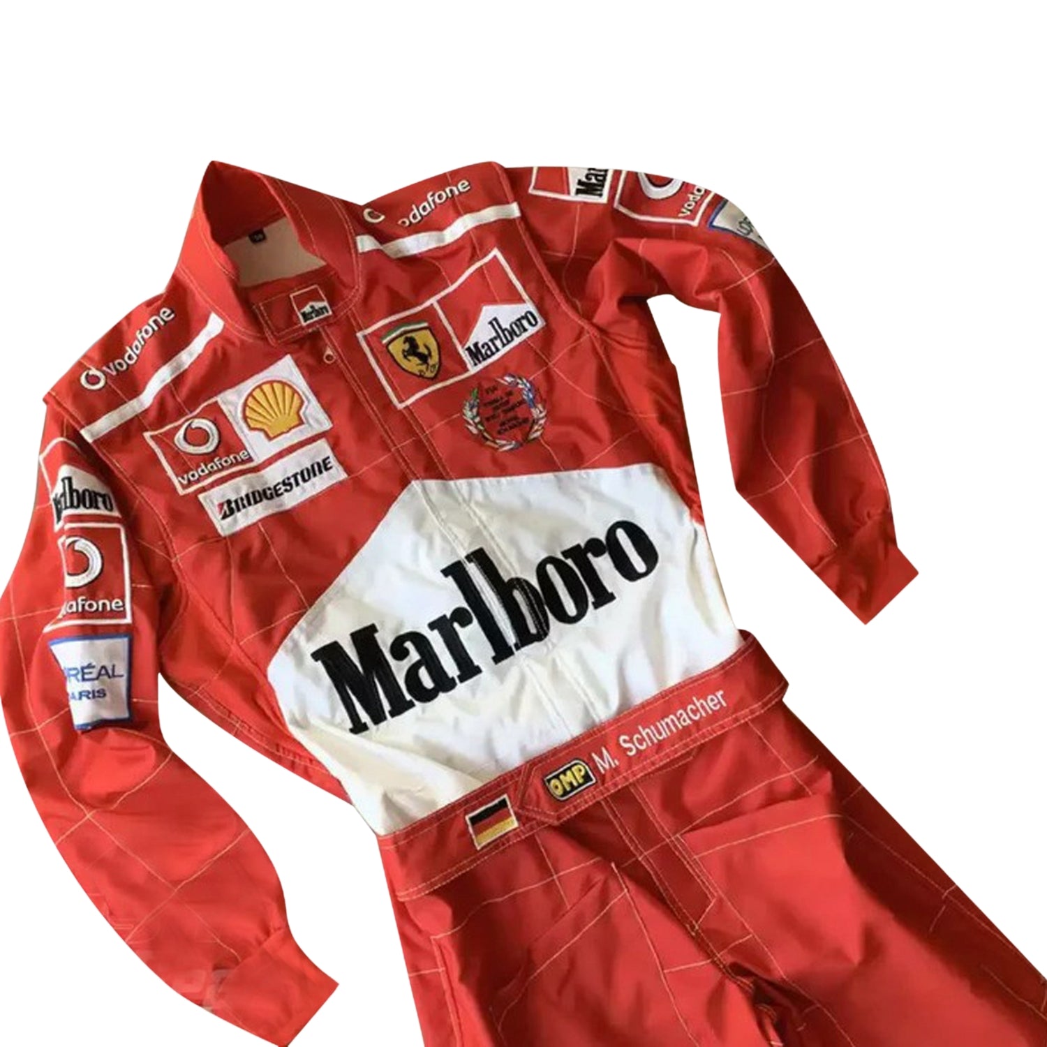 Close-up of the 2005 Schumacher suit highlighting fine embroidery, Ferrari red color tone, and precise stitching on race-worn sponsor badges.Bestracewear