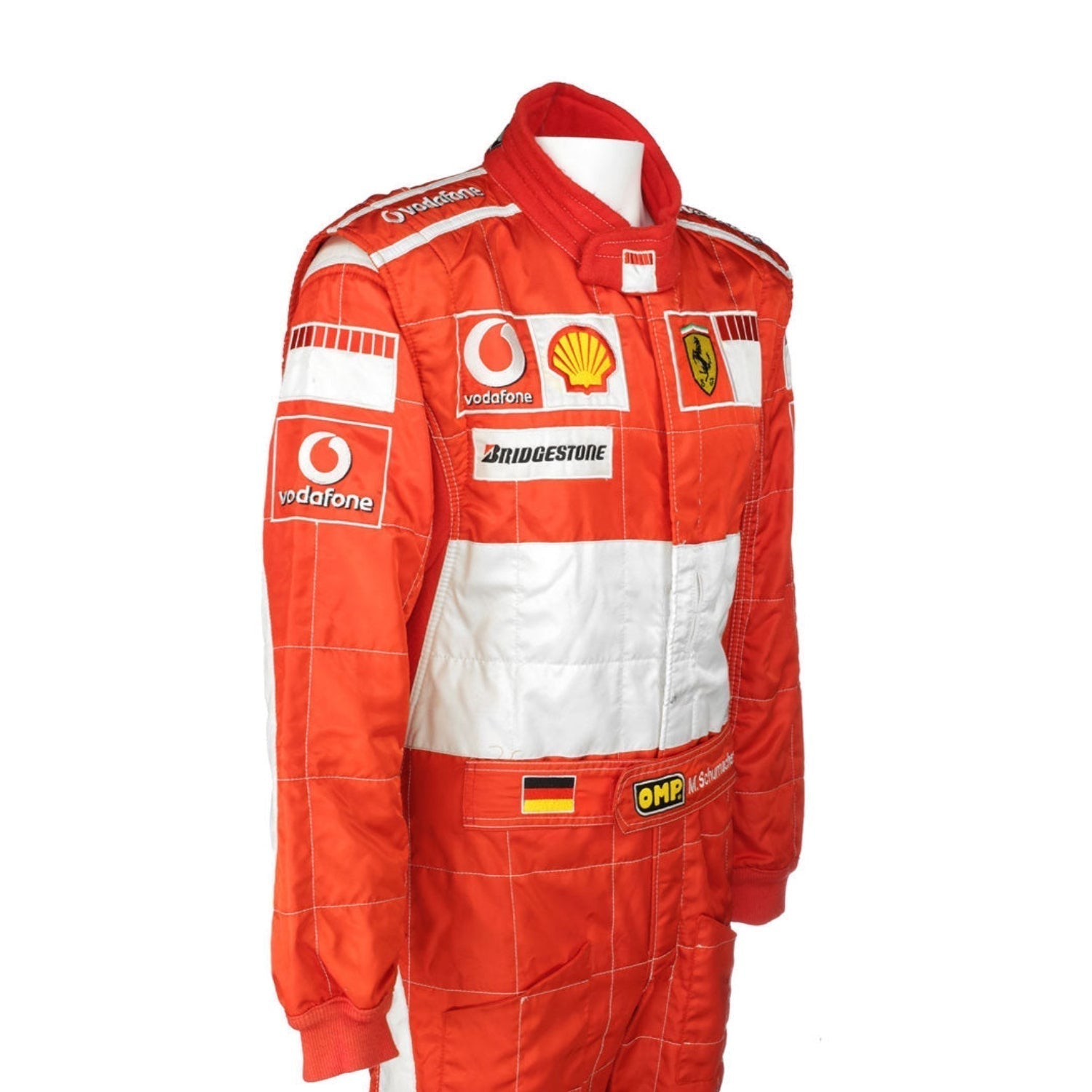 Side profile of the 2006 F1 suit worn by Michael Schumacher, featuring bright red fabric with sleek contouring and high-visibility white accents.Bestracewear